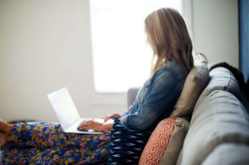 Angie Mizzell writing her weekly newsletter Hello. Friday